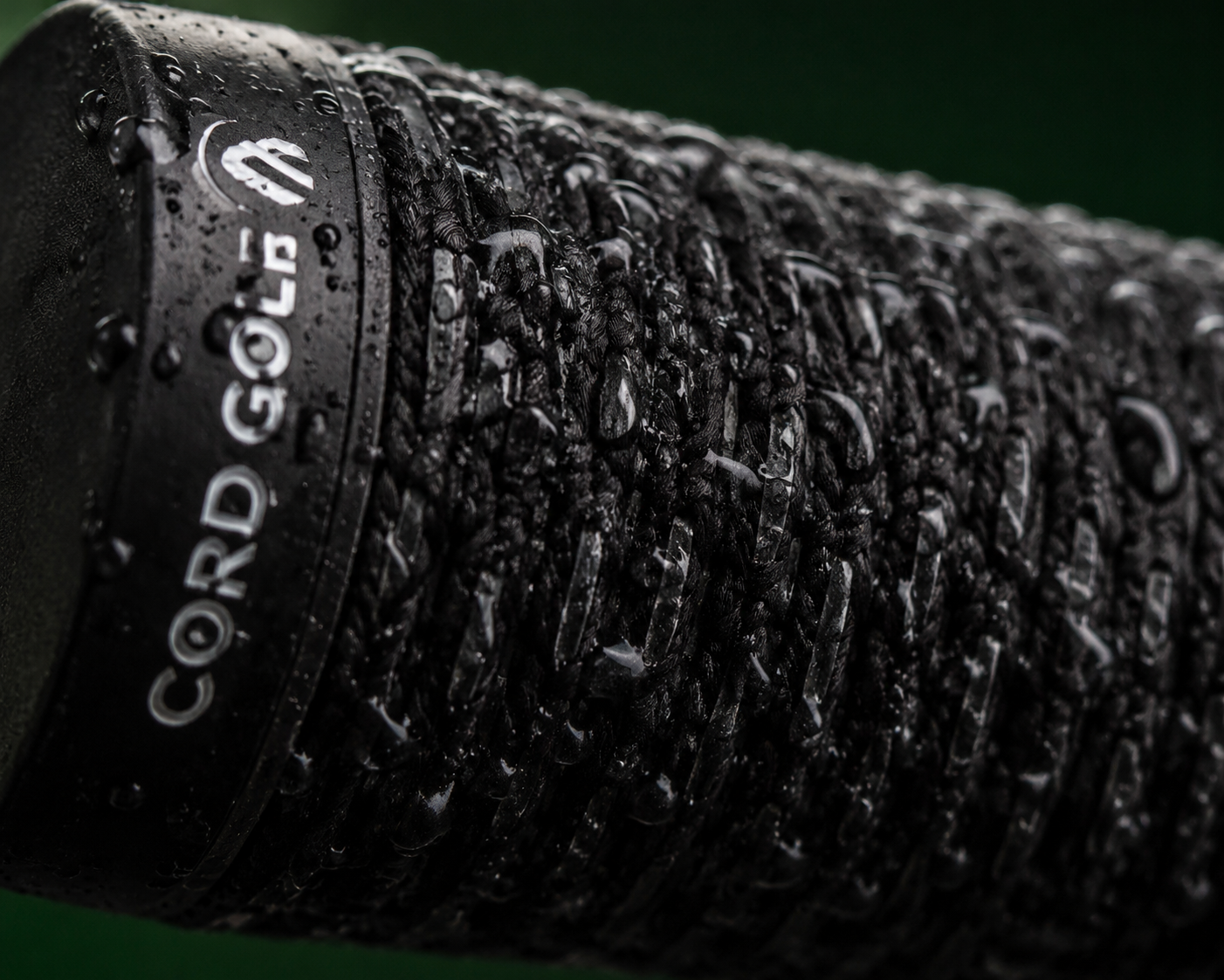 Cord golf grip detail showing woven fiber texture for wet weather traction